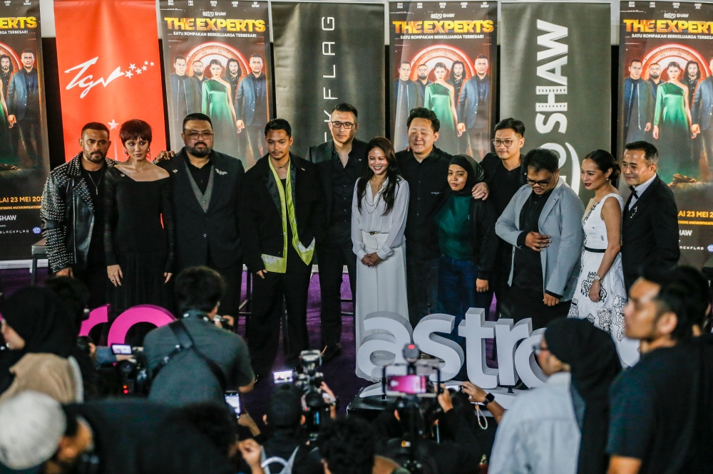 Cast and crew of ‘The Experts’ at the film's recent gala premiere in Sunway Velocity Mall. — Picture by Hari Anggara