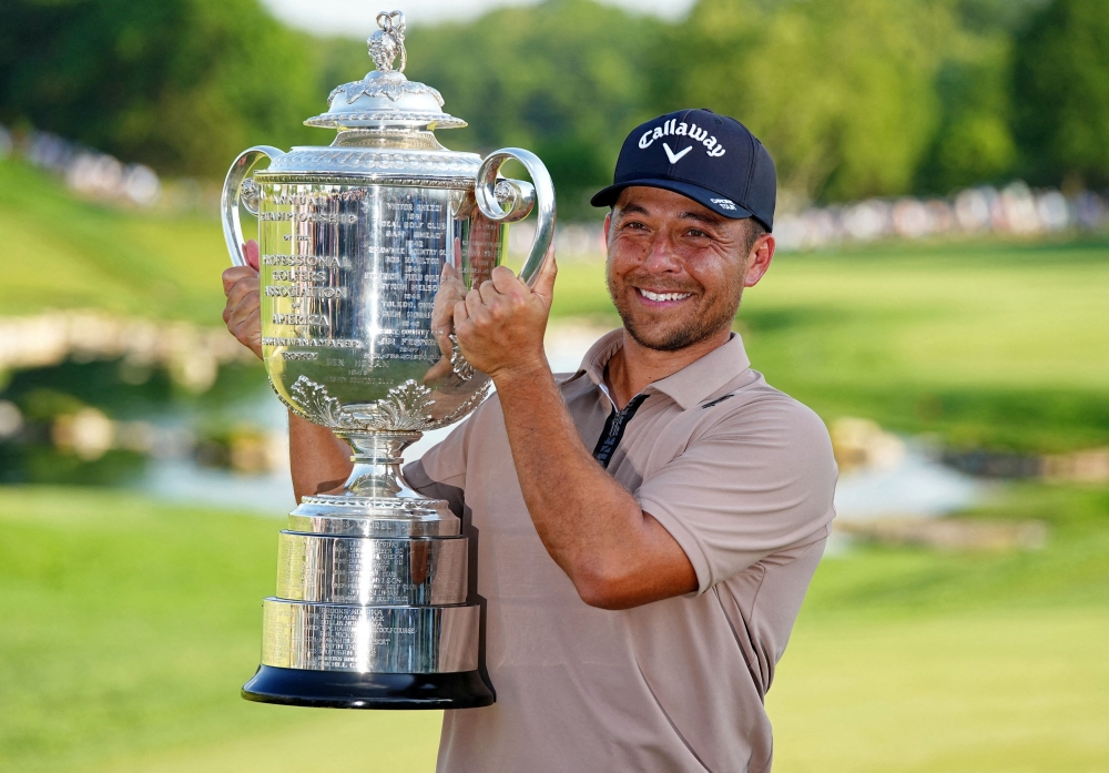 Xander Schauffele holds The Wanamaker Trophy after winning the PGA Championship golf tournament at Valhalla Golf Club in Louisville, Kentucky May 19, 2024. ― Adam Cairns-USA TODAY Sports     
