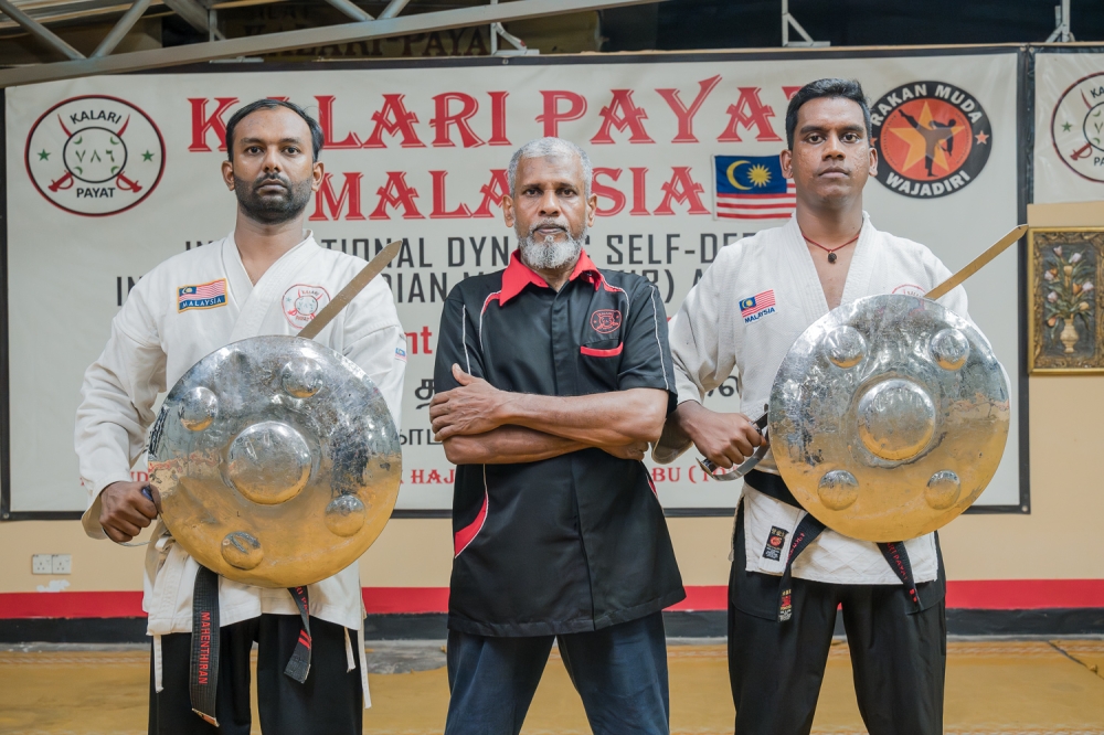 (From left) Master Mahenthiran Natarajan, Grandmaster Abdul Rahman Syed Mohamed and Master Kuganesh Sivasubramaniam conduct weekly training at Kalari Payat Academy. — Picture by Raymond Manuel