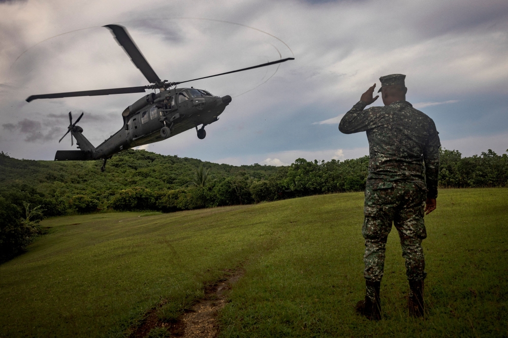A Philippine Air Force Black Hawk helicopter lands on Itbayat island during a trip of the chief of staff of the Armed Forces of the Philippines, in Batanes, Philippines June 29, 2023. — Ezra Acayan/Pool/Reuters pic