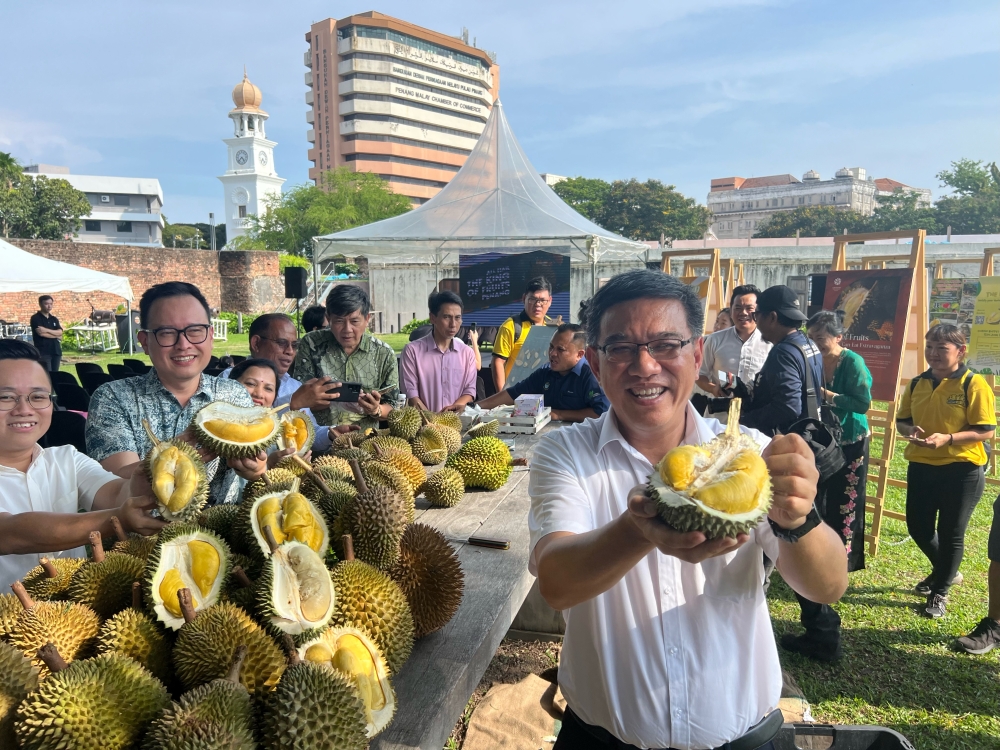 State tourism and creative economy committee chairman Wong Hon Wai (right) said there are many tourists from Southeast Asia who travel to Penang for its durians. — Picture by Opalyn Mok