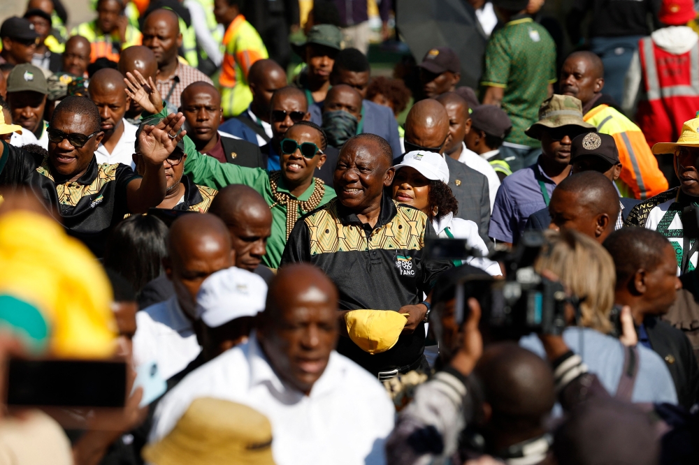 President of the ruling African National Congress (ANC) and South African President, Cyril Ramaphosa (centre), waves to supporters as he arrives for the party’s Siyanqoba Rally at FNB Stadium in Johannesburg on May 25, 2024 ahead of the countries upcoming national and provincial elections on May 29, 2024. — AFP pic