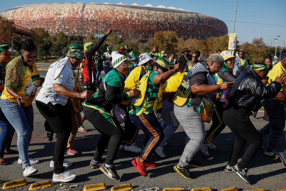 African National Congress (ANC) supporters sing and chant as they arrive for the ANC’s last rally at the FNB Stadium in Johannesburg on May 25, 2024, ahead of the South African elections scheduled for May 29, 2024. — AFP pic