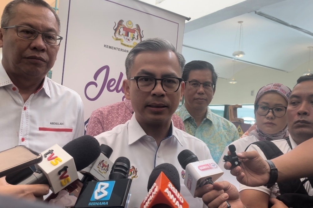 Communications Minister Fahmi Fadzil speaks to reporters after launching the ‘Jelajah Hawana Bersama Siswa 2024’ programme May 25, 2024. — The Borneo Post pic 