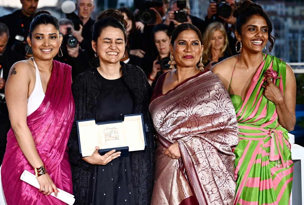 (From left) Indian actress Divya Prabha, Indian director Payal Kapadia, Indian actress Chhaya Kadam and Indian actress Kani Kusruti pose during a photocall after winning the Grand Prix for the film ‘All We Imagine as Light’. — AFP pic