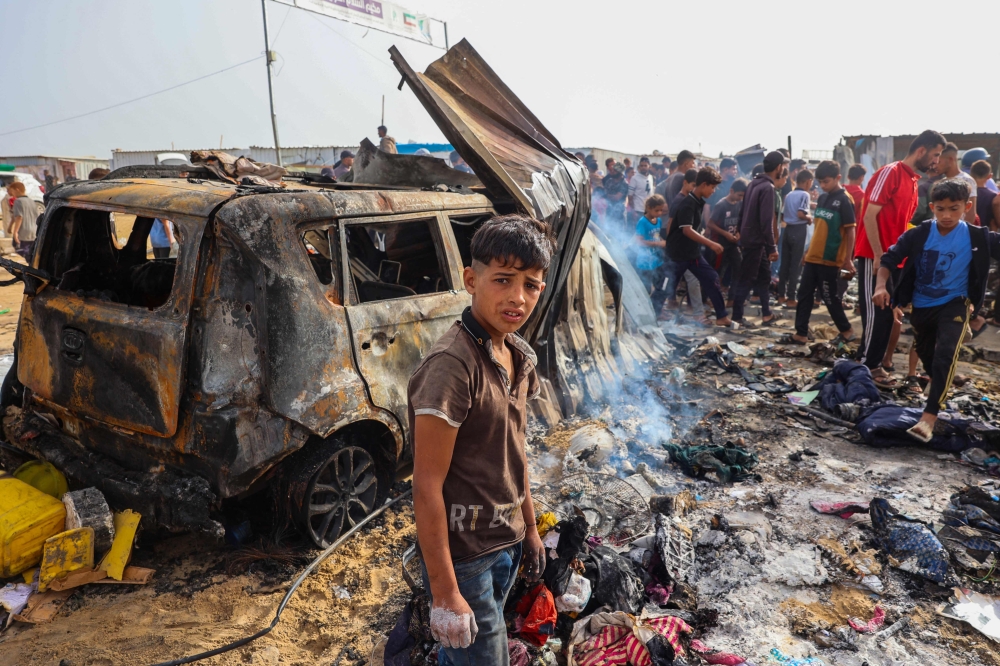 Palestinians gather at the site of an Israeli strike on a camp area housing internally displaced people in Rafah on May 27, 2024. — AFP pic 