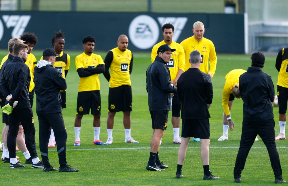 Borussia Dortmund coach Edin Terzic in a huddle with players and coaching staff during training at Borussia Dortmund Training Centre, Dortmund, May 28, 2024. — Reuters pic 