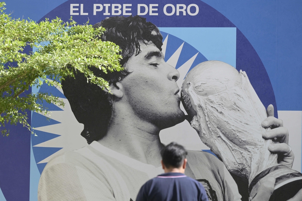 An image of late football star Diego Maradona is seen on the second anniversary of his death at CONMEBOL fan zone ‘Tree of dreams’ in Doha, on November 25, 2022. ― AFP file pic