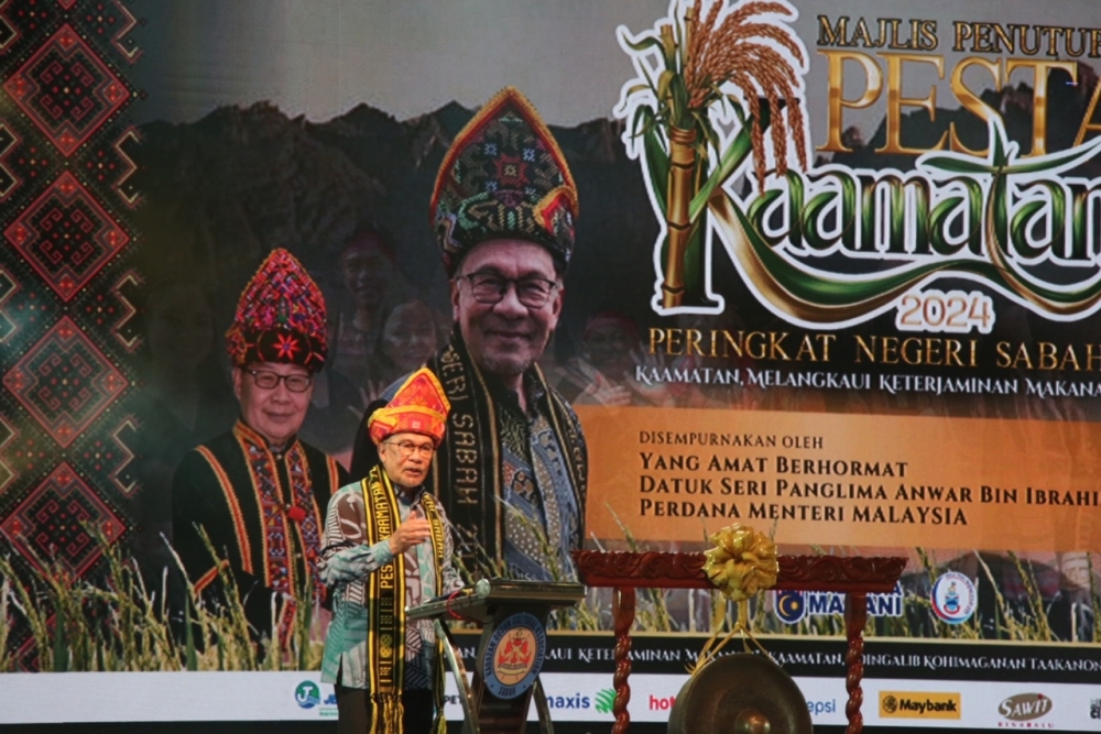 Prime Minister Datuk Seri Anwar Ibrahim (centre) speaks at the closing ceremony of the Ka’amatan festival in Kota Kinabalu May 31, 2024. 