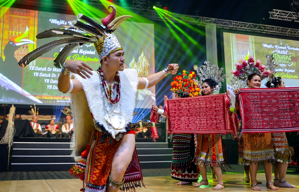 Dancers wearing traditional Iban costumes perform 'tarian ngajat' at the Gawai Dayak open house in Kuching June 1, 2024. — Bernama pic