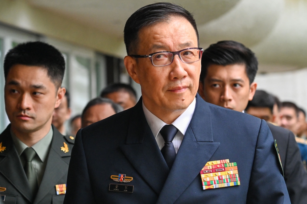 China’s Defence Minister Dong Jun arrives with his delegation for a bilateral meeting with US Secretary of Defence Lloyd Austin on the side-lines of the 21st Shangri-La Dialogue summit at the Shangri-La Hotel in Singapore on May 31, 2024. — AFP pic