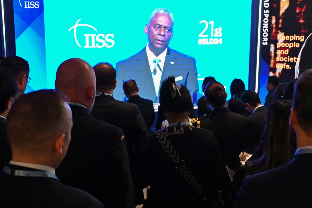 Attendees watch US Secretary of Defence Lloyd Austin speak at the 21st Shangri-La Dialogue summit in Singapore on June 1, 2024. — AFP pic