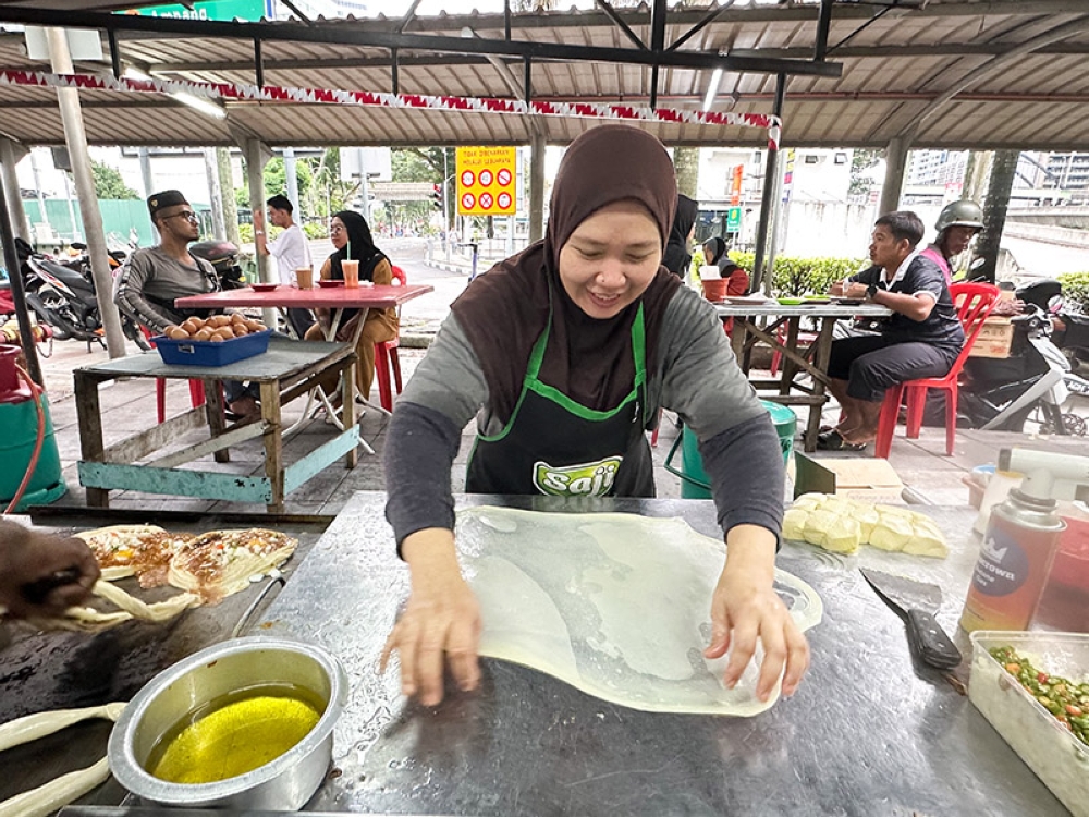 The hot griddle in the restaurant is where the action happens as dough is stretched to make various flatbreads