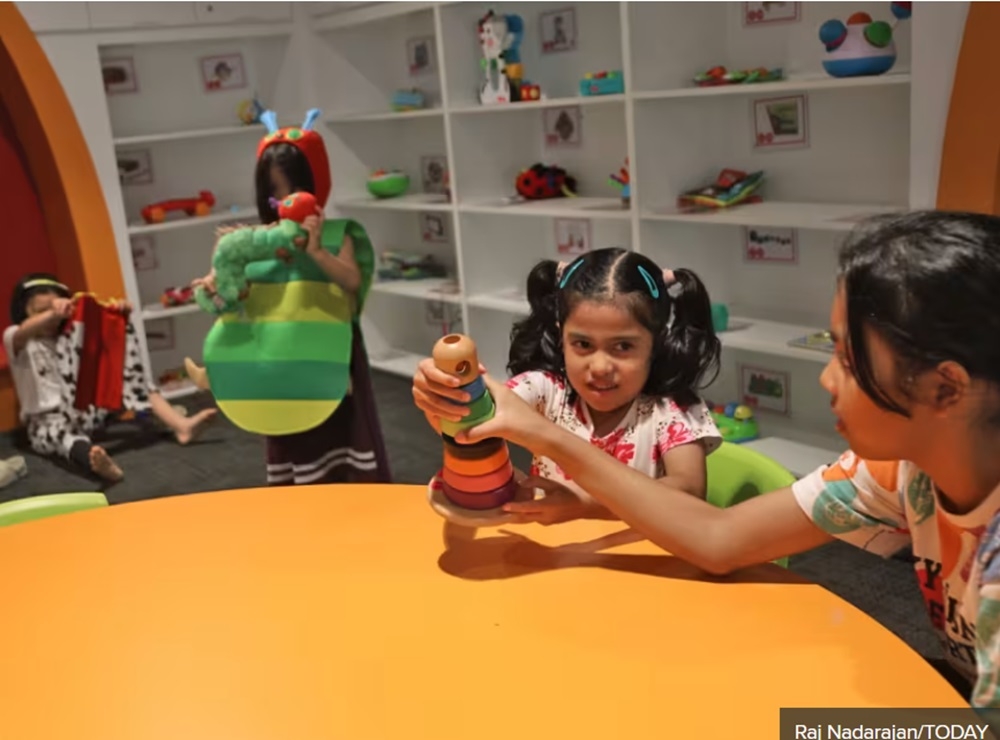 Suhaila’s six-year-old daughter playing with an educational stacking block toy at the Toy Library in Singapore May 27, 2024. — TODAY pic 
