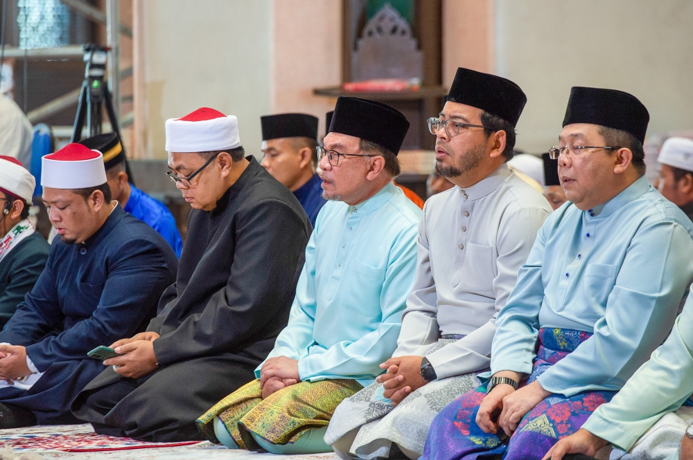 Prime Minister Datuk Seri Anwar Ibrahim (centre) recited takbir raya with the congregation before performing the Aidiladha prayers led by the Grand Imam of Putra Mosque Salahuddin Ghozali.