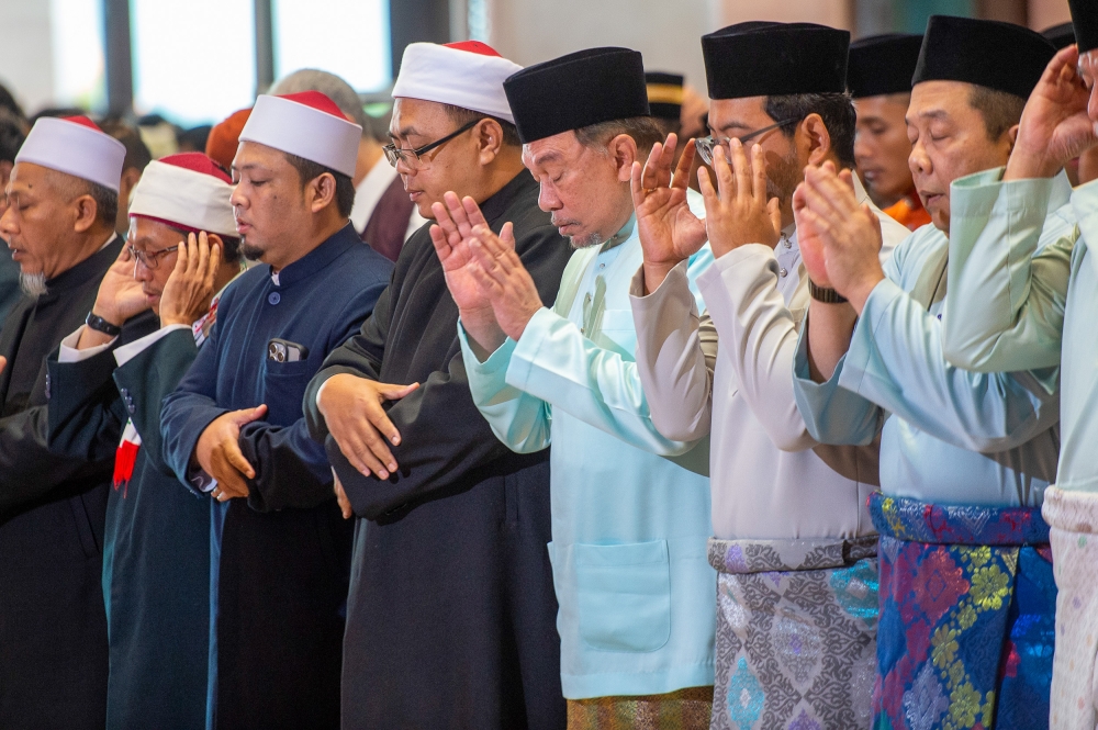 Prime Minister Datuk Seri Anwar Ibrahim (centre) performs Aidiladha prayers at the Putra Mosque in Putrajaya June 17, 2024. 