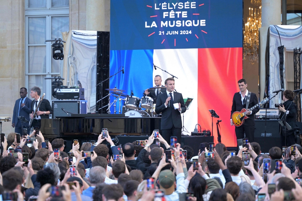 France’s President Emmanuel Macron speaks during the annual ‘Fete de la musique’ one-day music festival in the courtyard of the Elysee presidential palace in Paris on June 21, 2024. — AFP pic