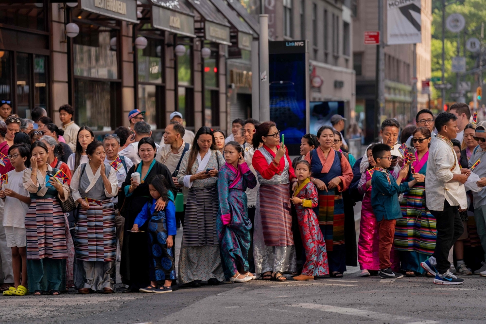 People await the arrival of Tibetan spiritual leader the Dalai Lama at his hotel in New York on June 23, 2024. — AFP pic