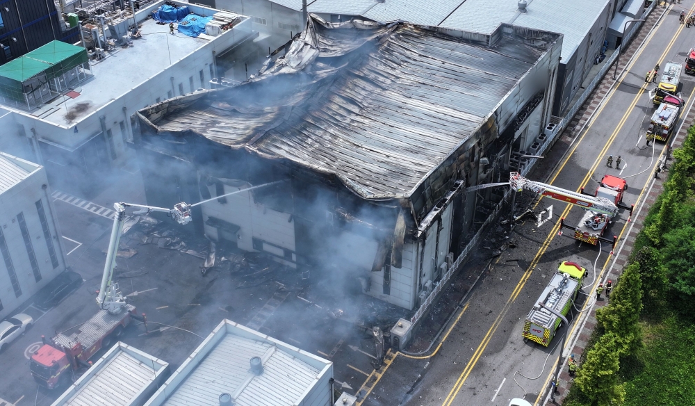 This photo shows an aerial view of firefighters working to extinguish a fire at a lithium battery factory in Hwaseong. — AFP pic/Yonhap