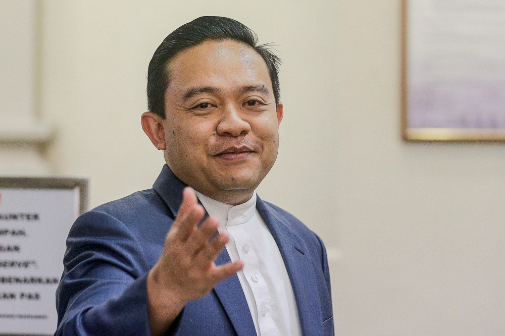 Wan Saiful said the motion against him was defective. At a press conference in Parliament, he shared with reporters purported proof to back his claim that the court charges brought against him could be dropped if he declared support for Prime Minister Datuk Seri Anwar Ibrahim. — File picture by Sayuti Zainudin