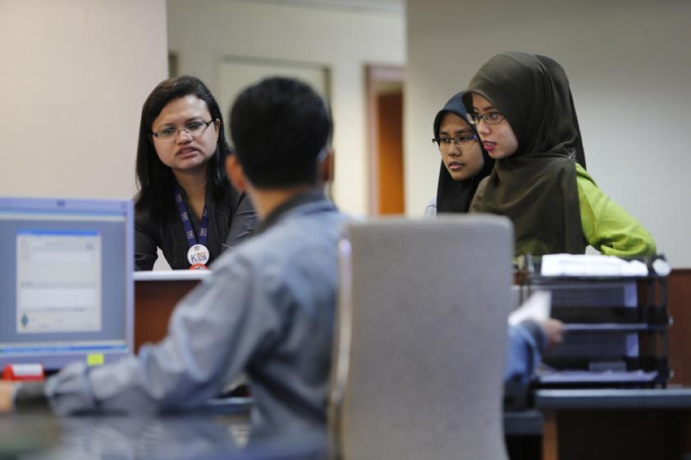 The open secret in many Malaysian offices today is that people feel tangible guilt if they fail to 'appear' super-busy, even when no one is watching. — Reuters pic
