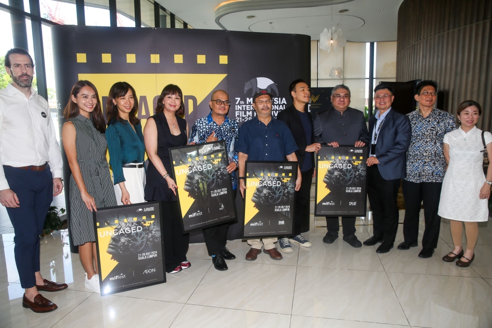 Goh (fourth from left) with some of MIFFest official partners at the press conference. — Picture by Choo Choy May