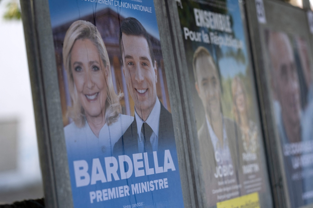 This photograph shows a campaign poster of the French far-right Rassemblement National (RN) party for the upcoming French legislative elections in Callac, western France, on June 27, 2024. — AFP pic