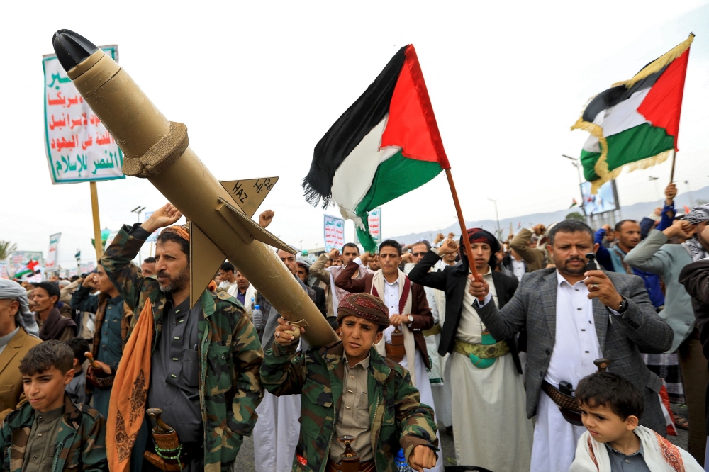 Yemenis wave Palestinian flags and hold mock rockets during a march in the Houthi-run capital Sanaa in solidarity with the people of Gaza on June 28, 2024, amid the ongoing conflict between Israel and the militant Hamas group in the Gaza Strip. — AFP pic