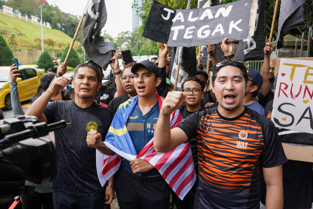 Muar MP Syed Saddiq Abdul Rahman arrives at Parliament compound for his Langkah Muar initiative running 200km from Muar. July 1, 2024. — Picture by Shafwan Zaidon