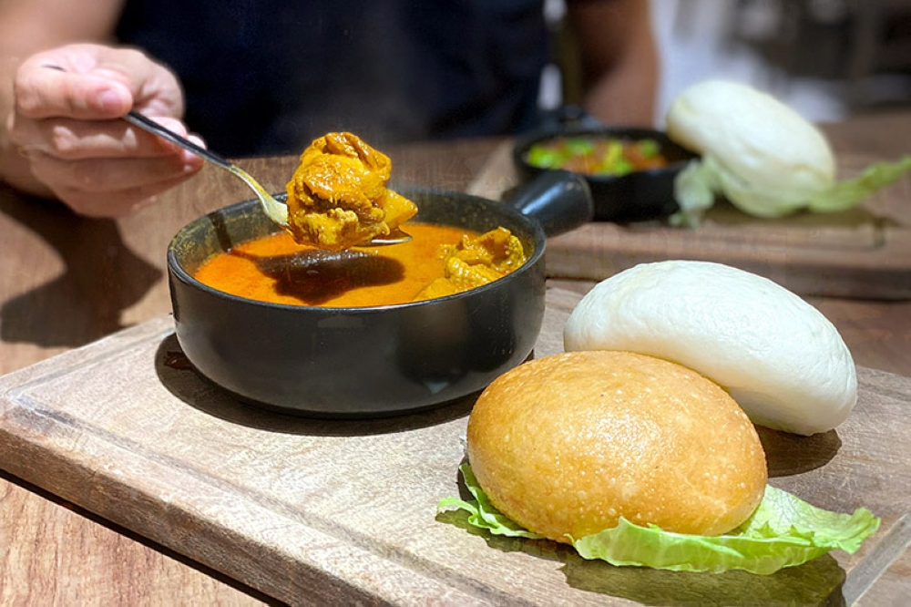 Signature Boneless Curry Chicken with fried and steamed 'mantou'.