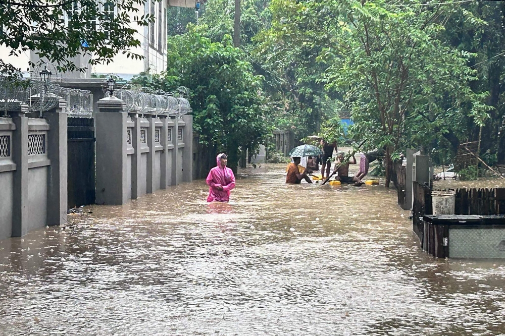 Floods in northern Myanmar have trapped thousands of people in their homes and cut electricity and phone lines, residents and local media said today, with the state weather office warning of more heavy rain. — AFP pic