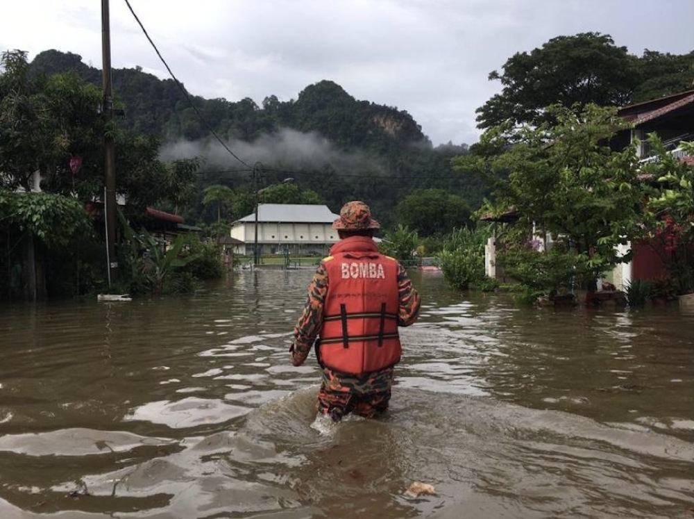 Heavy rains caused widespread flooding in Penampang, possible Sabah district's worst in 20 years. — File picture via Twitter/Bernama