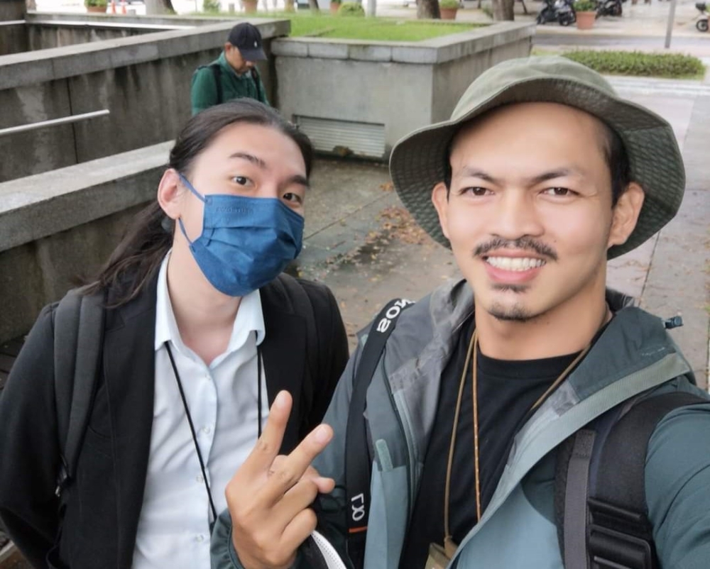 The writer (in mask) and his colleague Shafwan Zaidon at the conclusion of Najib's final appeal at the Palace of Justice.