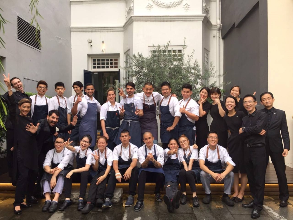 Lau (second from top left) with the rest of the team at Restaurant André when chef Virgilio Martinez of Central came to Singapore for a four-hands dinner in 2016. — Picture via Facebook.com/Restaurant André