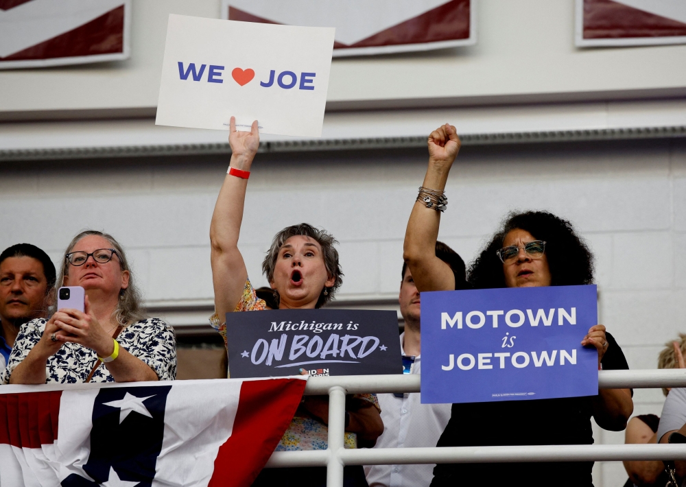 Supporters cheer as US President Joe Biden speaks during a campaign stop in Detroit, Michigan July 12, 2024. — Reuters pic  