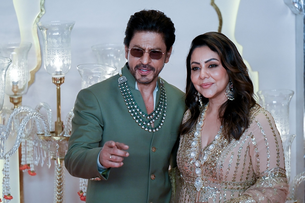 Shah Rukh Khan with his wife Gauri Khan. — AFP pic