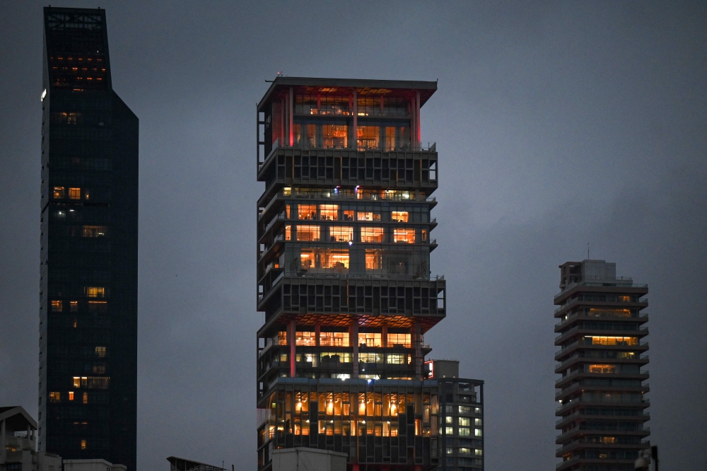 The 27-floor family home Antilia is one of Mumbai’s most prominent landmarks, and lit up ahead of the wedding ceremony July 9, 2024. — AFP pic