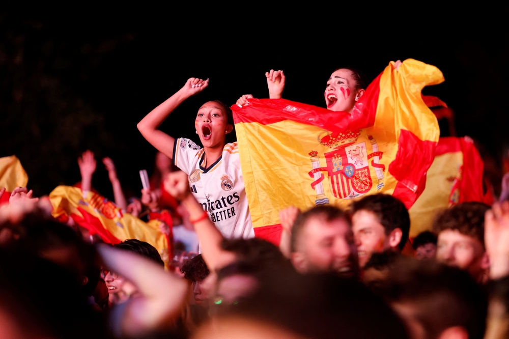 Spain fans celebrate Spain’s victory in the Uefa Euro 2024 final football match between Spain and England, in Madrid July 14, 2024. — AFP pic