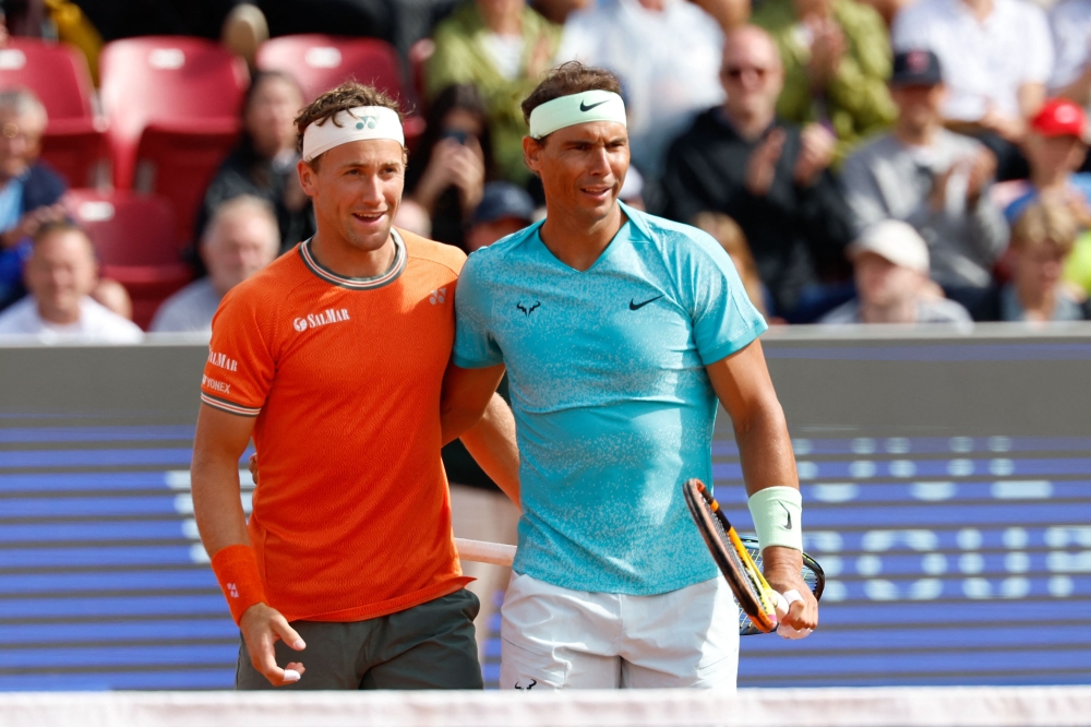 Spain's Rafael Nadal (right) and Norway's Casper Ruud react after winning the men's doubles tennis match against Argentina's Guido Andreozzi and Mexico's Miguel Reyes-Varela during the Nordea Open ATP tennis tournament in Bastad July 15, 2024. — Adam IHSE/TT News Agency/AFP pic