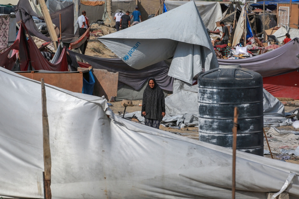 Palestinians salvage items at the site of Israeli bombardment a day earlier on the al-Mawasi displacement camp of Khan Yunis city in the southern Gaza Strip on July 14, 2024, amid the ongoing conflict between Israel and the Palestinian Hamas group in Gaza. — AFP pic