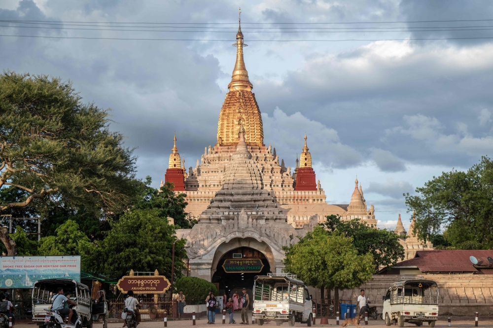 This photo taken on July 7, 2024 shows people visiting the Ananda Temple in Bagan in Myanmar’s central Mandalay Region. — AFP pic 