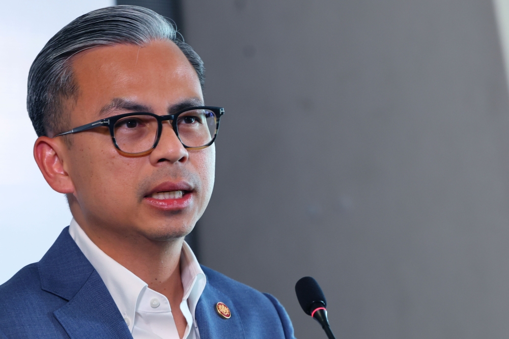 Communications Minister Fahmi Fadzil today said that the government is looking to enact a new and relevant cyberbullying law following the death of cyberbullying victim and influencer Rajeswary Appahu, known as Esha. — Bernama pic    