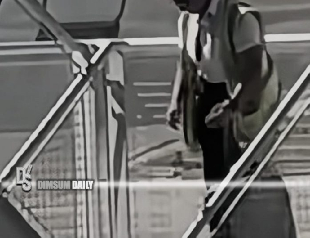 The video shows a staff member dressed in a Cathay Pacific vest, negligently throwing suitcases down a flight of stairs from an aircraft to the tarmac. — Screengrab via X/Dimsumdaily Hong Kong