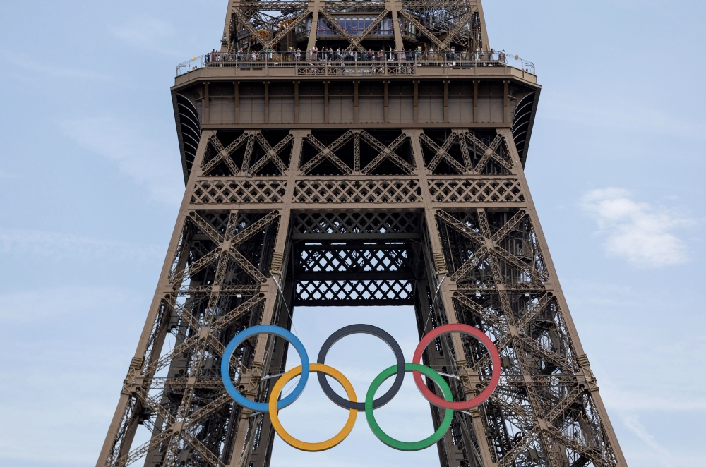 Olympic rings are pictured on the Eiffel tower in Paris, France, on July 18, 2024. — Reuters pic