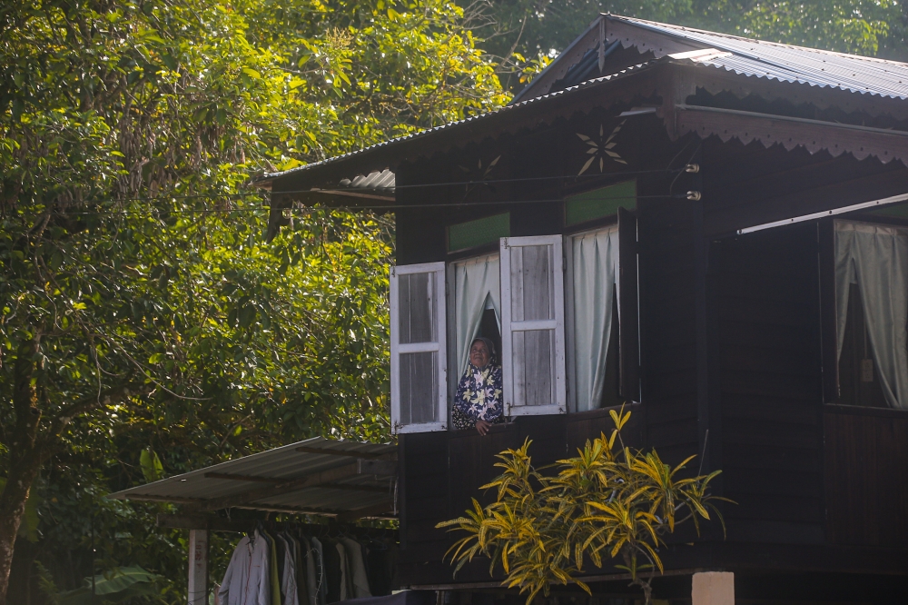 A file photograph shows an open window at a house in Chemor Perak. — Picture by Farhan Najib