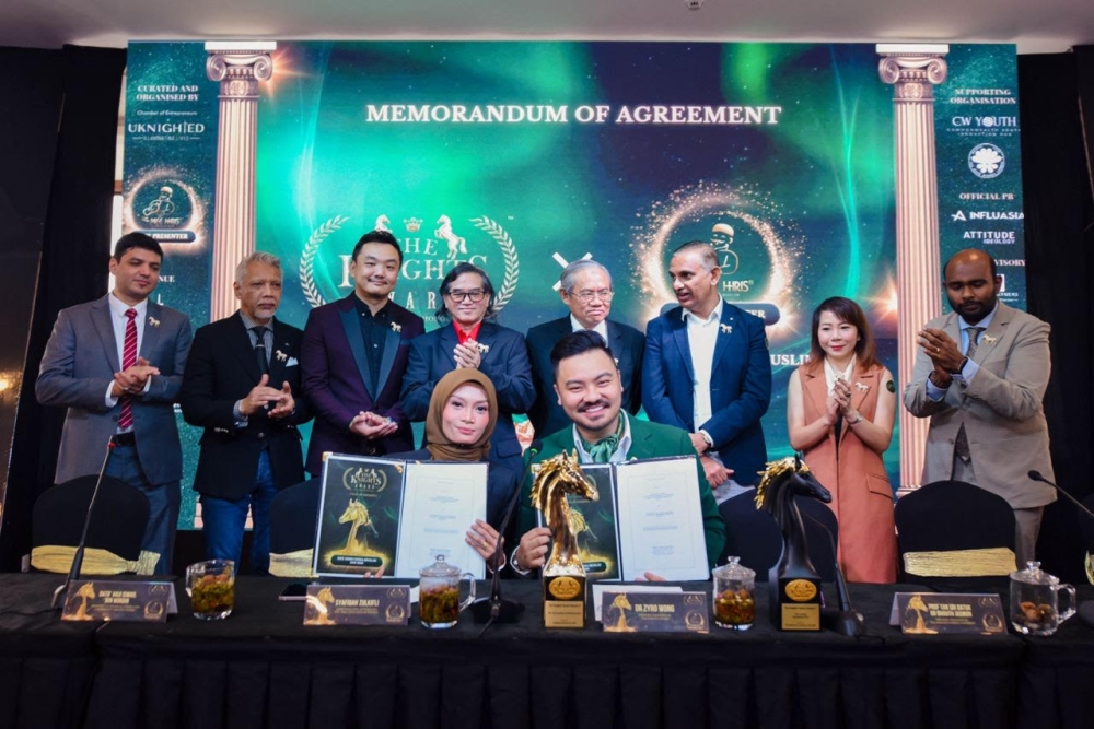 At a recent press conference, a MOU was signed between Wong (seated, right) and Syafiqah.— Picture courtesy of Knights Award