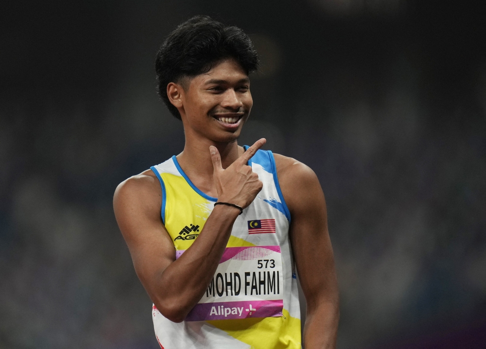 National runner Muhammad Azeem Fahmi said it is an honour to represent his country on the biggest sporting stage. — Reuters pic