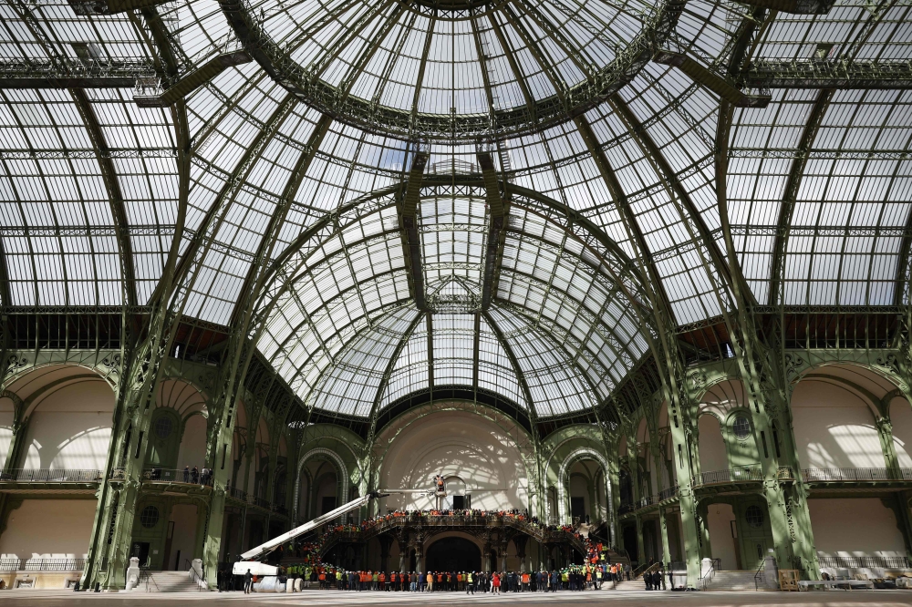 Paris 2024 organisers opted mostly for pre-existing or temporary infrastructure to host the event, avoiding the significant environmental cost from carbon-intensive building materials like concrete and steel. Pictured here, the Grand Palais, which will host fencing and taekwondo competitions. — AFP pic