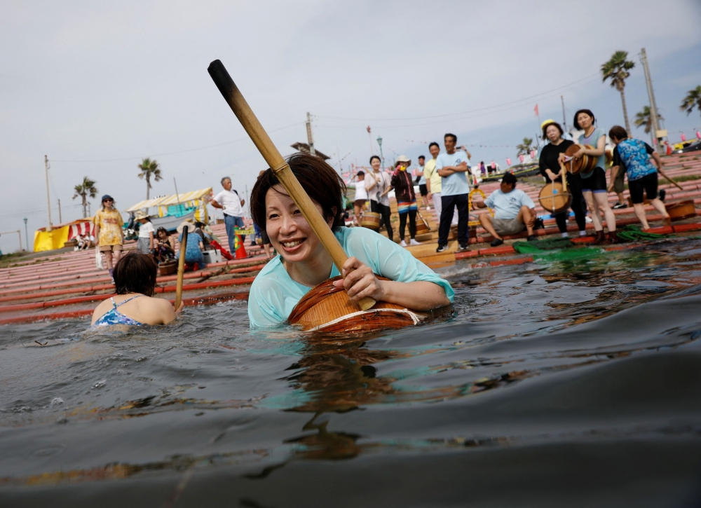 Volunteers practice swimming ahead of Shirahama Ama matsuri in Minamiboso, Chiba Prefecture, Japan July 20, 2024. — Reuters pic