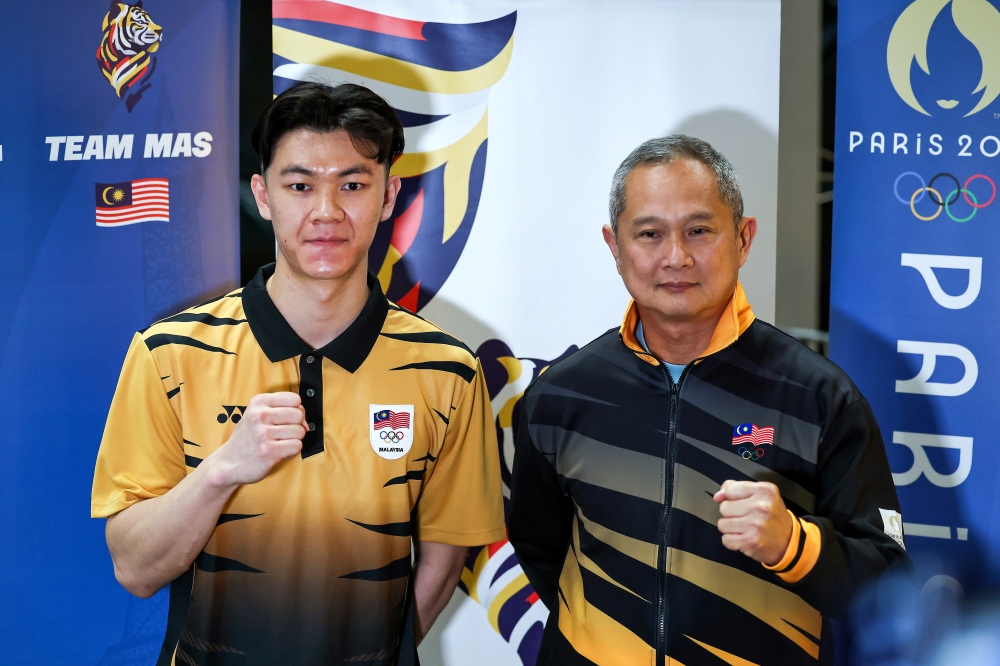 National men’s singles badminton champion Lee Zii Jia poses for a photo before leaving for the Paris 2024 Olympic Games at KLIA July 23, 2024. — Bernama pic